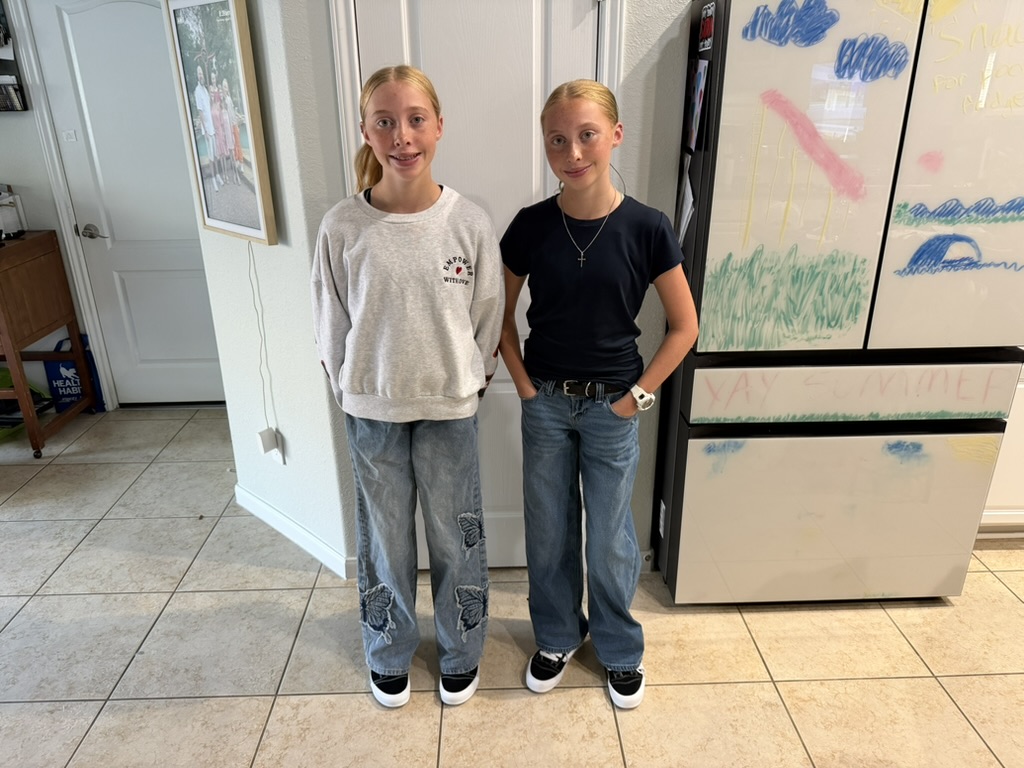 Sisters hanging out in the kitchen
